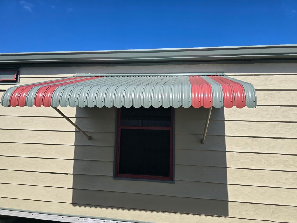 Restored vintage awning with crisp painted detailing